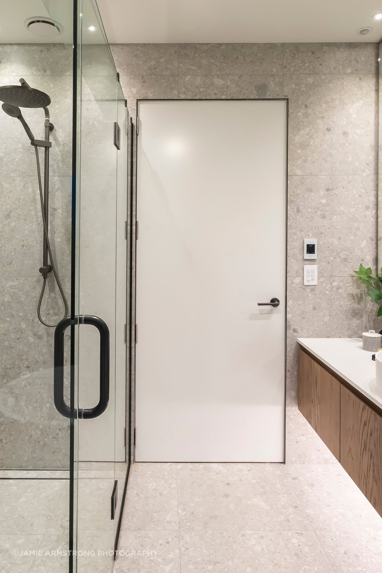 Floor to ceiling tiles add luxury to the bathrooms.