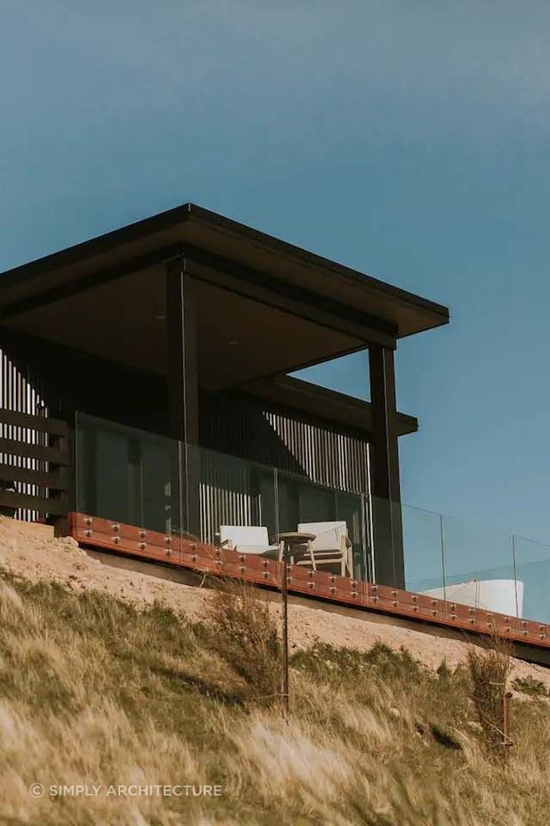 The 'Seafield' project boasts a dark exterior made of corrugated iron cladding, creating a showstopper guest home for their client.