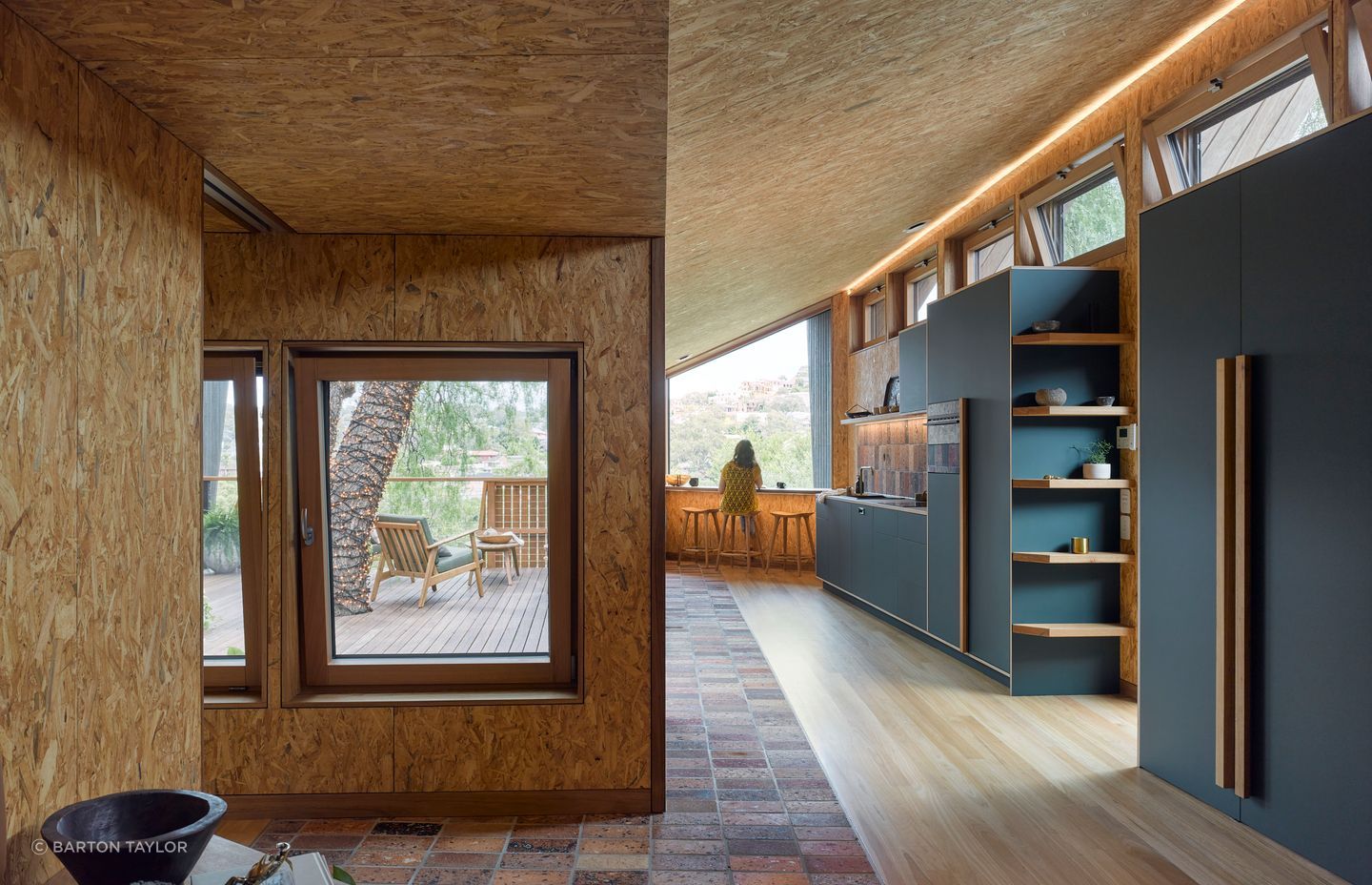 The sustainability lens unfurls between the natural and raw material palette – making use of recycled timber cladding and waste-concrete pavers.