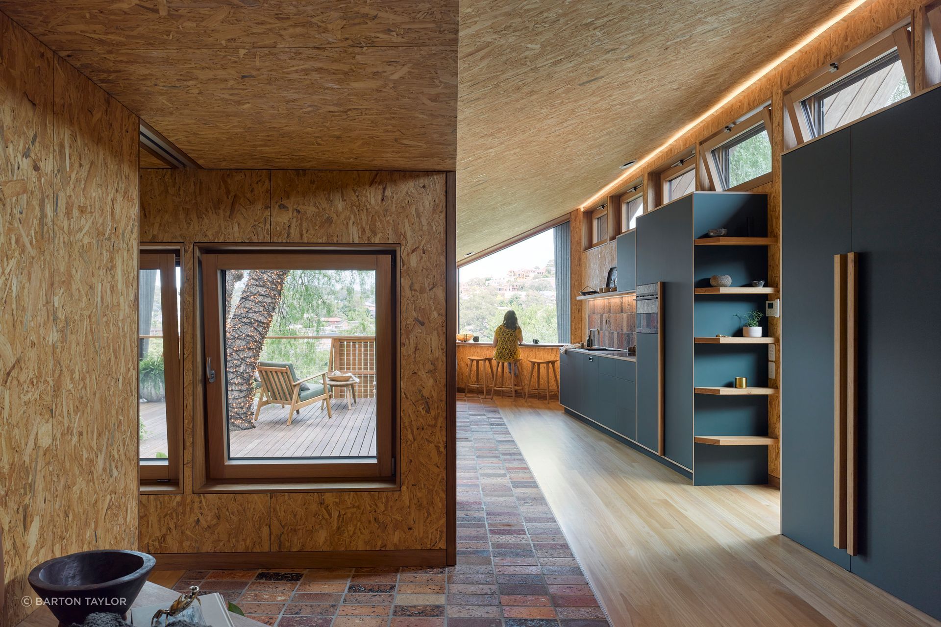The sustainability lens unfurls between the natural and raw material palette – making use of recycled timber cladding and waste-concrete pavers.