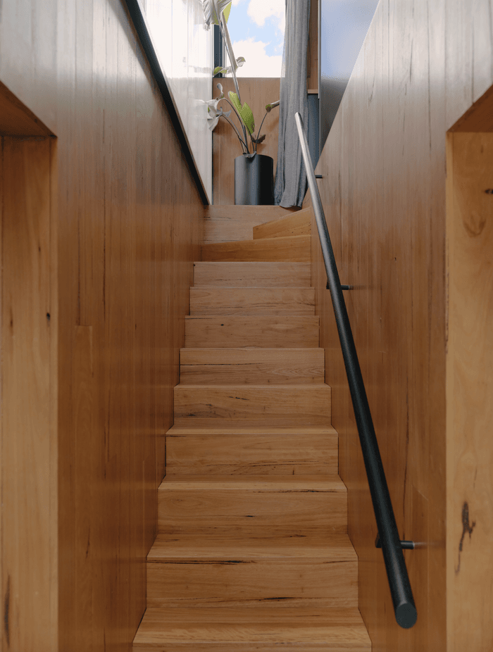 Stunning textural finishes are prominent throughout the earthy, light-filled home.