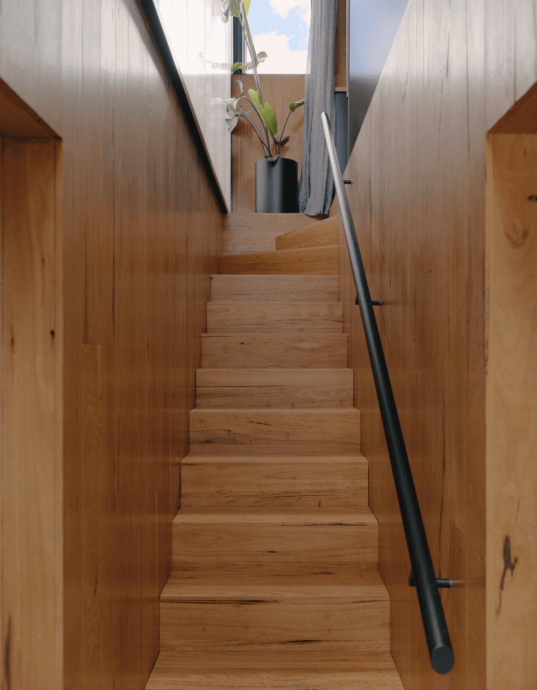 Stunning textural finishes are prominent throughout the earthy, light-filled home.