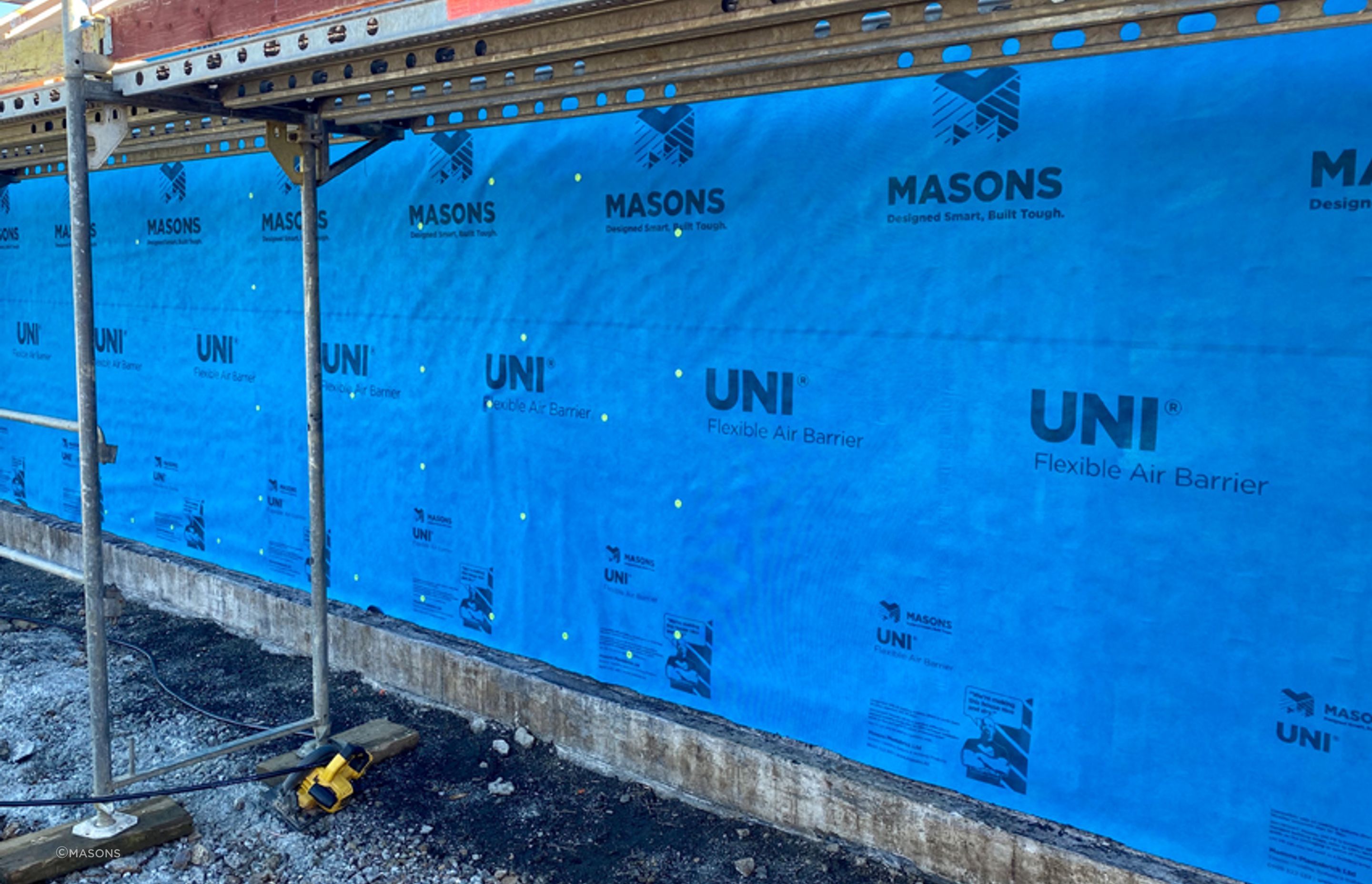 UNI FR is a flexible air barrier with unique reinforcing and water-resistant features that allows work to continue on the inside of the building for up to 90-days, without waiting for the cladding to be complete.