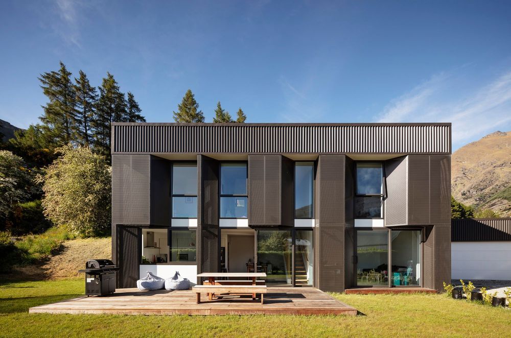 Built on a tight budget, mesh screens provide shading over low-E, double-glazed, thermally broken aluminium joinery on Arthurs Point Steel House by Team Green Architects. Photograph by Sam Hartnett.