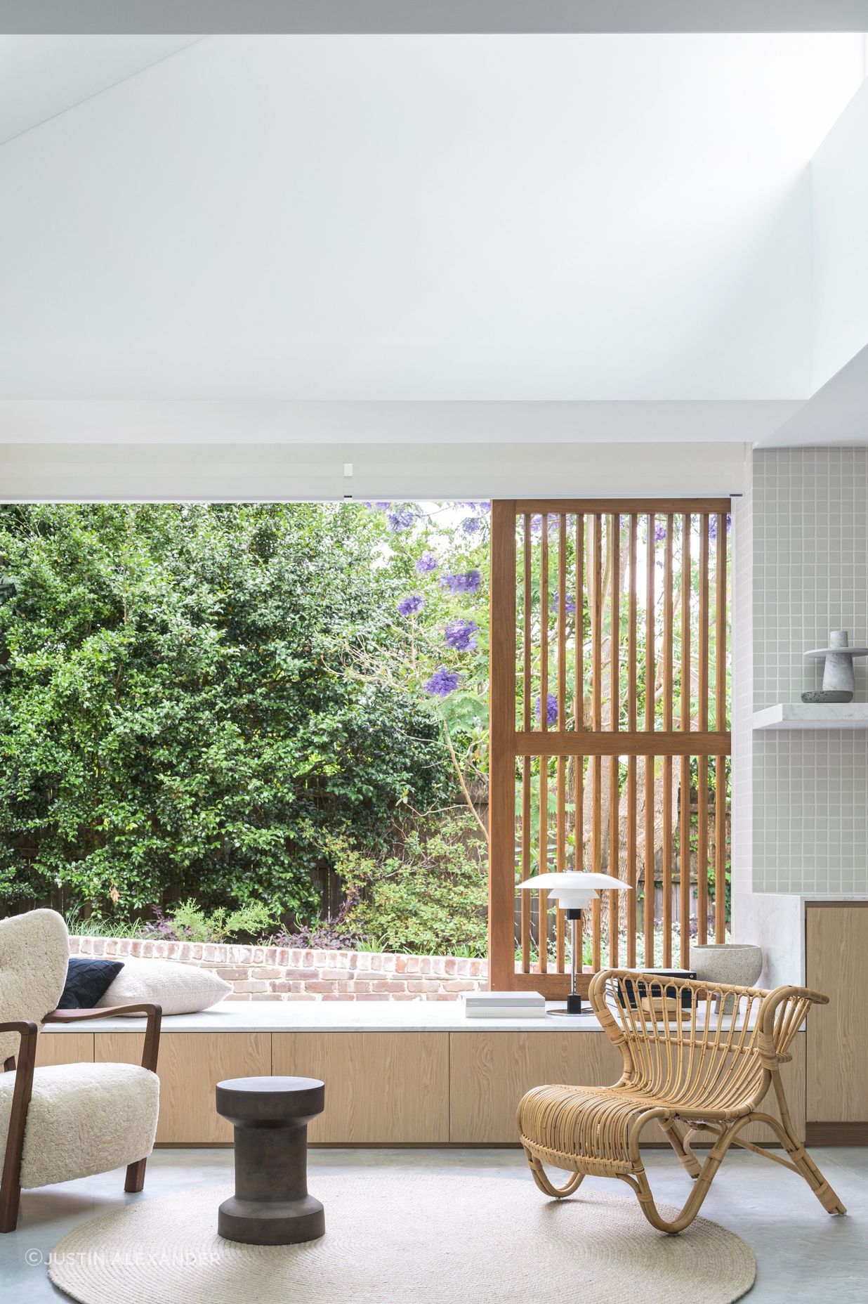 A window seat looks out to the shared garden.