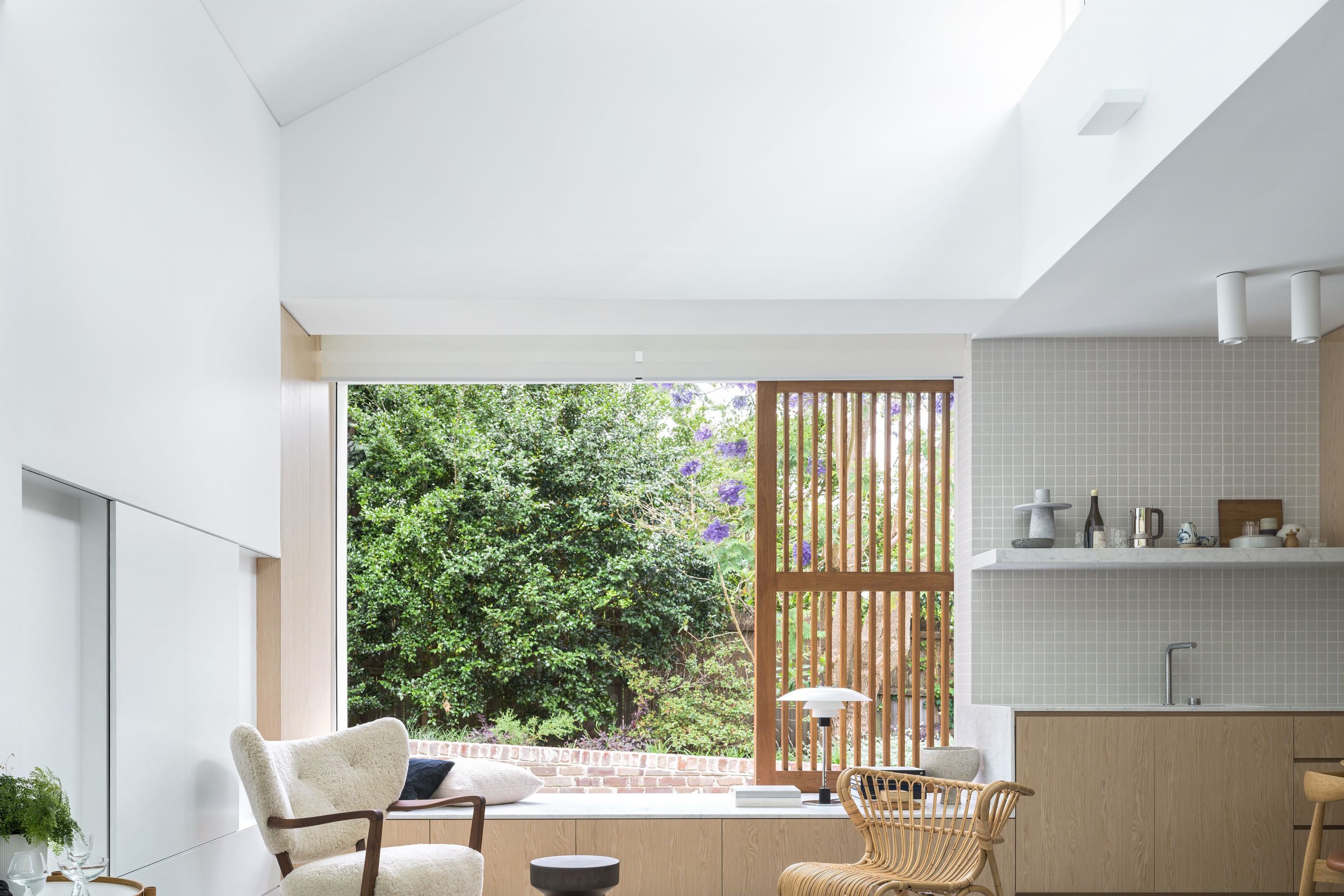 A window seat looks out to the shared garden.