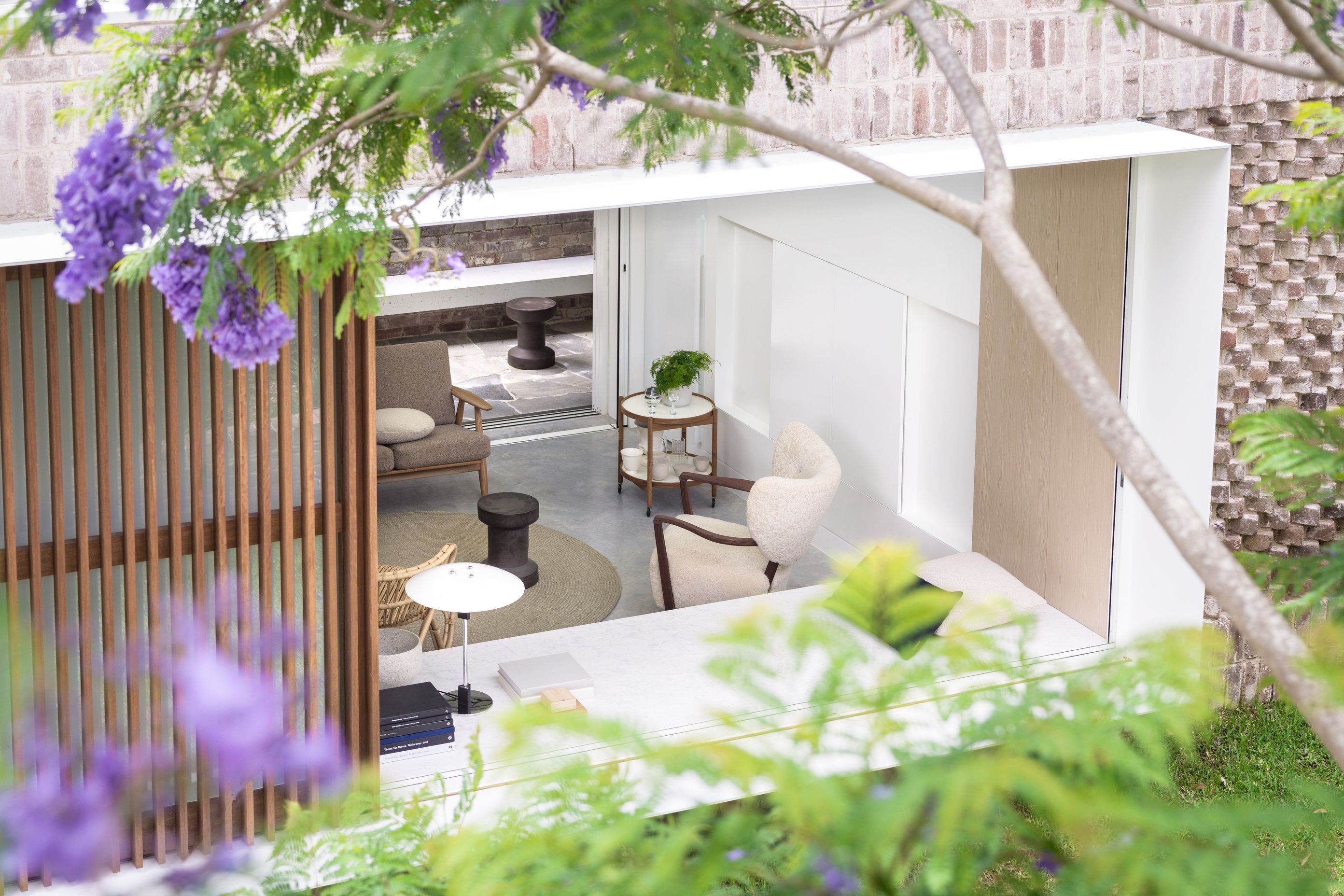 The home opens up to connect with the shared garden.