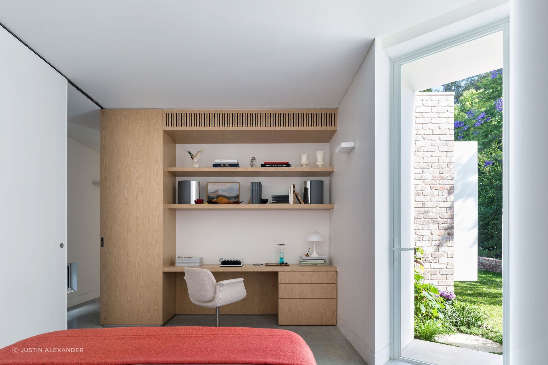 The bedroom doubles as a work from home space.