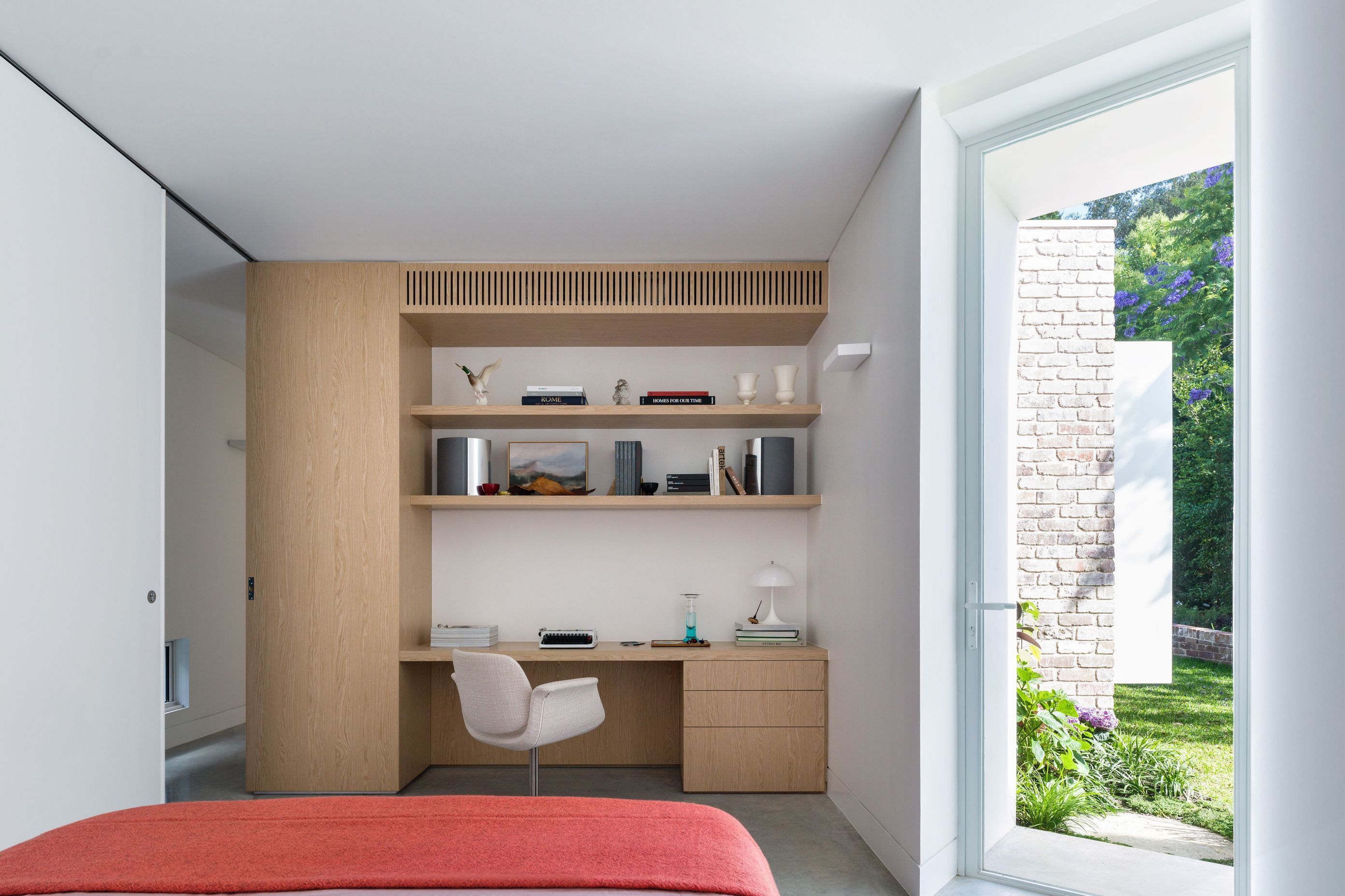 The bedroom doubles as a work from home space.