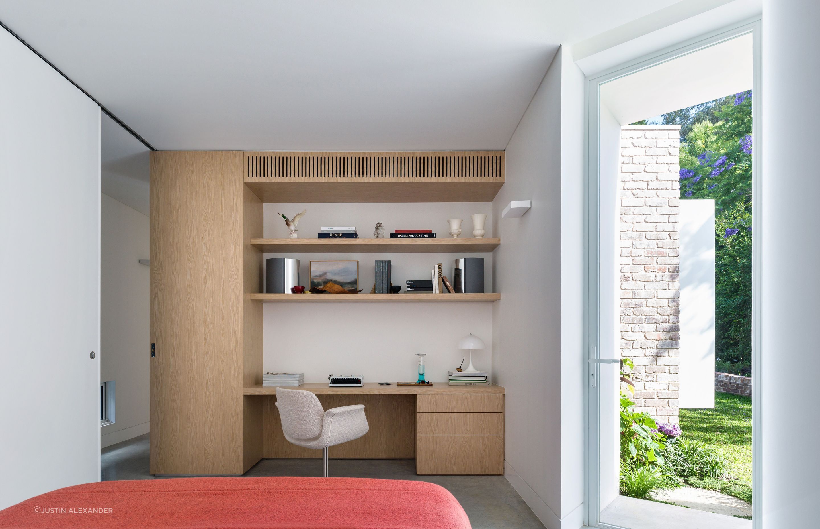The bedroom doubles as a work from home space.