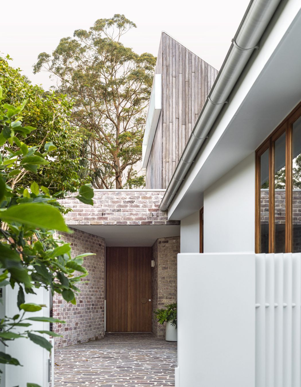 The dwelling has its own entrance via a canopy of brick work.