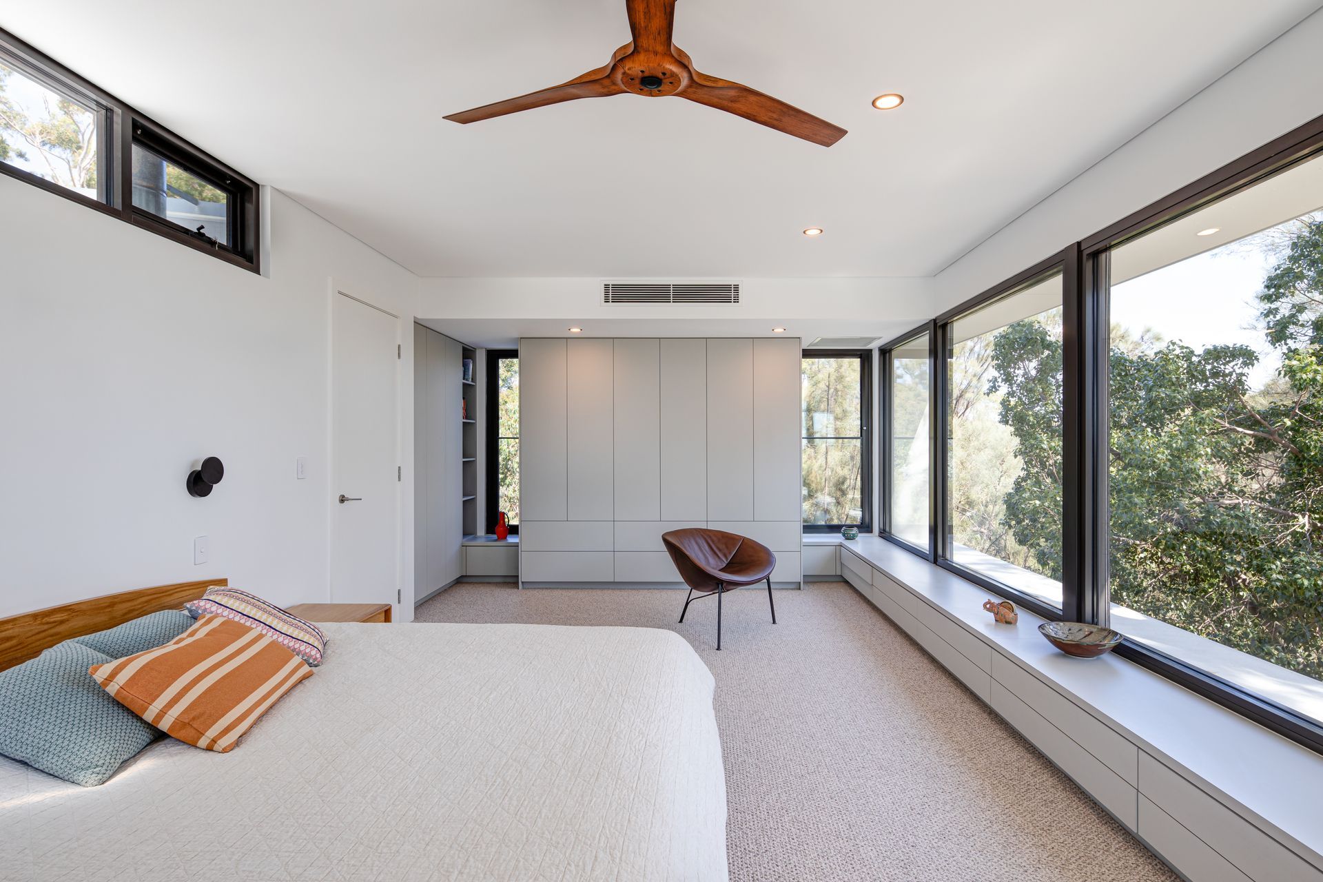 Perched among the tree canopies, The Treehouse introduces an elegant master suite, complete with a luxurious bathroom, to the beloved family residence.