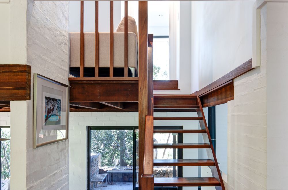A seamless connection is created between the space and the existing upper floor through the original jarrah staircase.