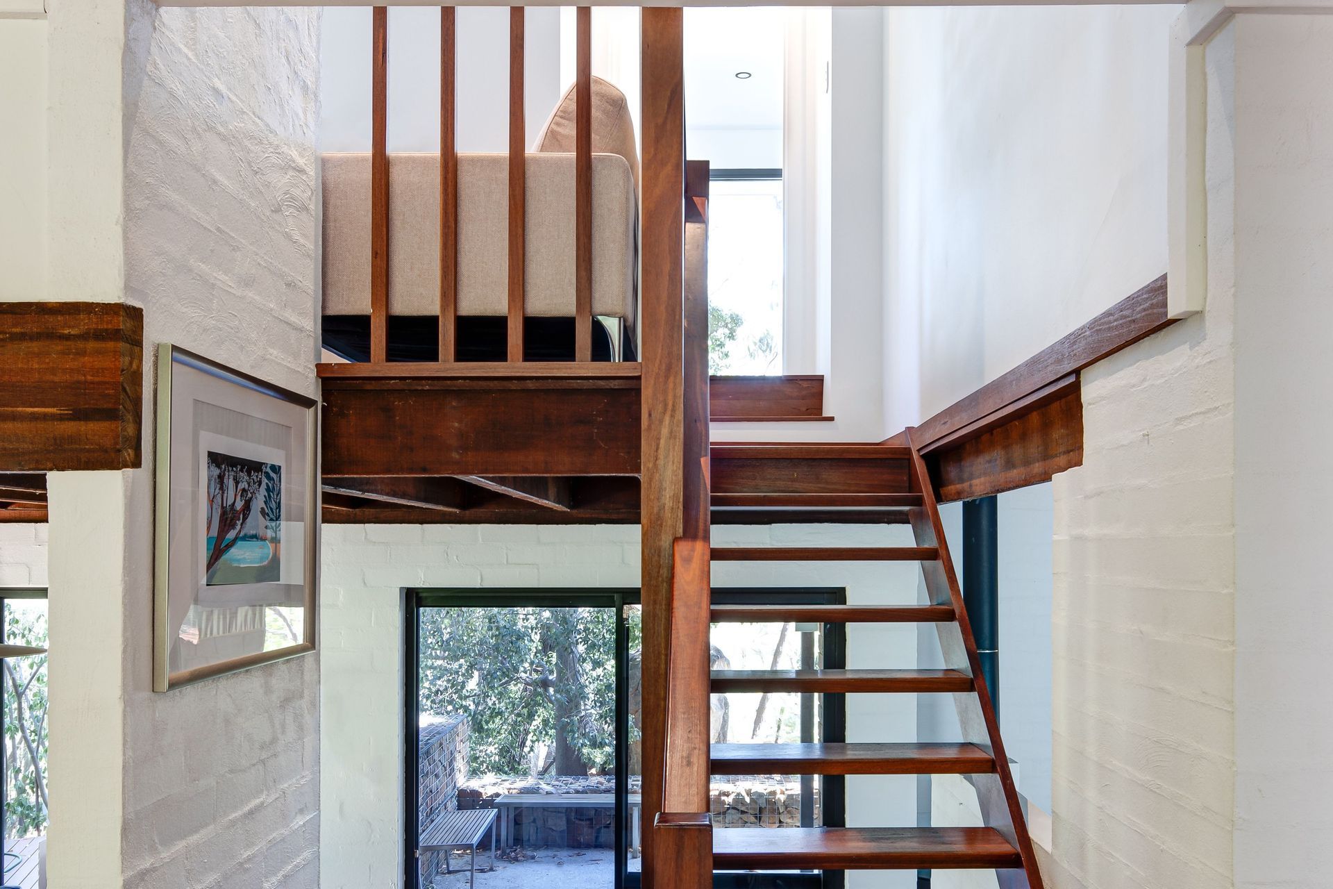 A seamless connection is created between the space and the existing upper floor through the original jarrah staircase.