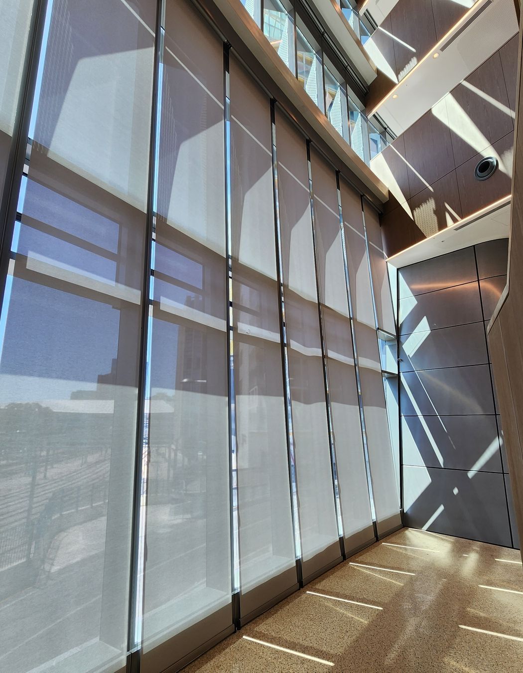 For the void area, a heavy-duty blind system was needed that could operate effectively with an 8-metre drop.