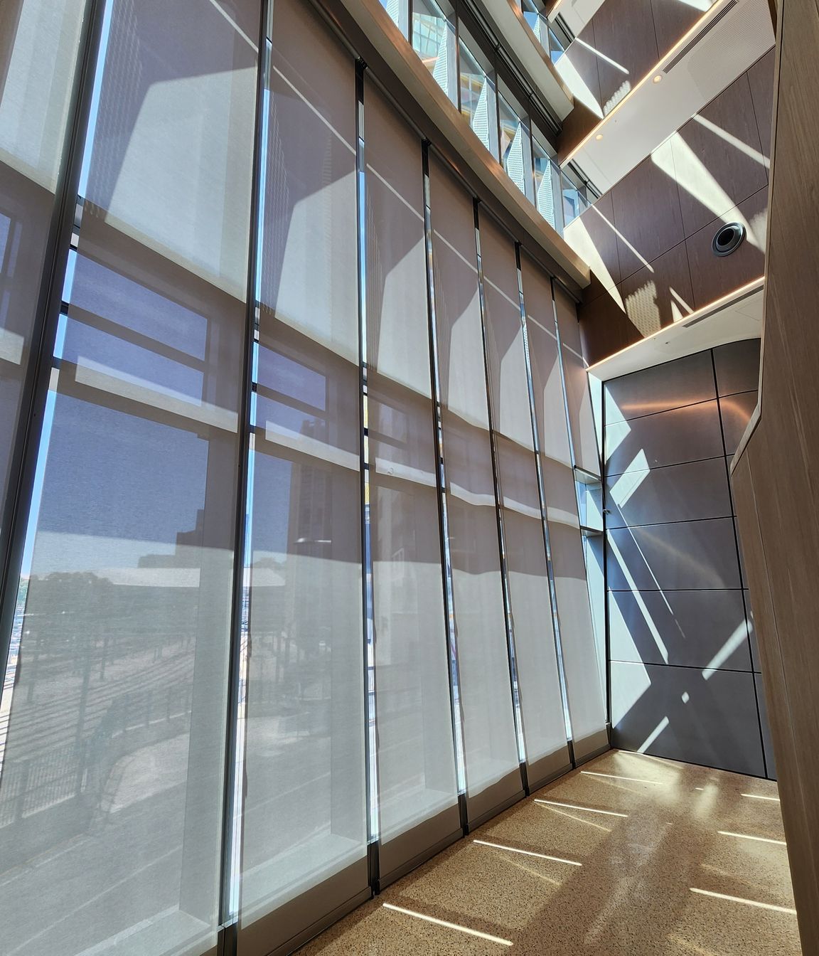 For the void area, a heavy-duty blind system was needed that could operate effectively with an 8-metre drop.