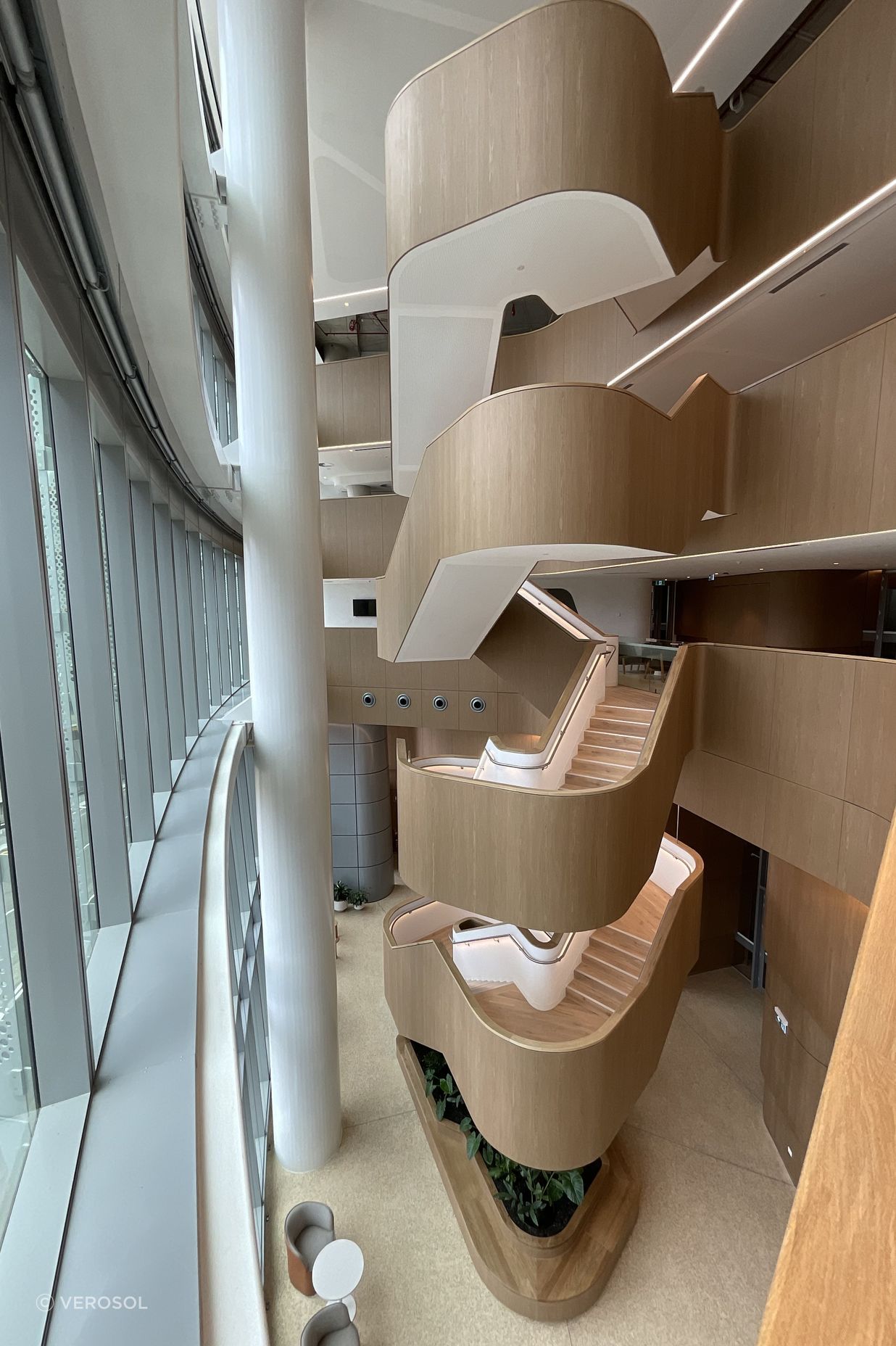 An abundance of natural light, biophilic curves and warm timber materials.
