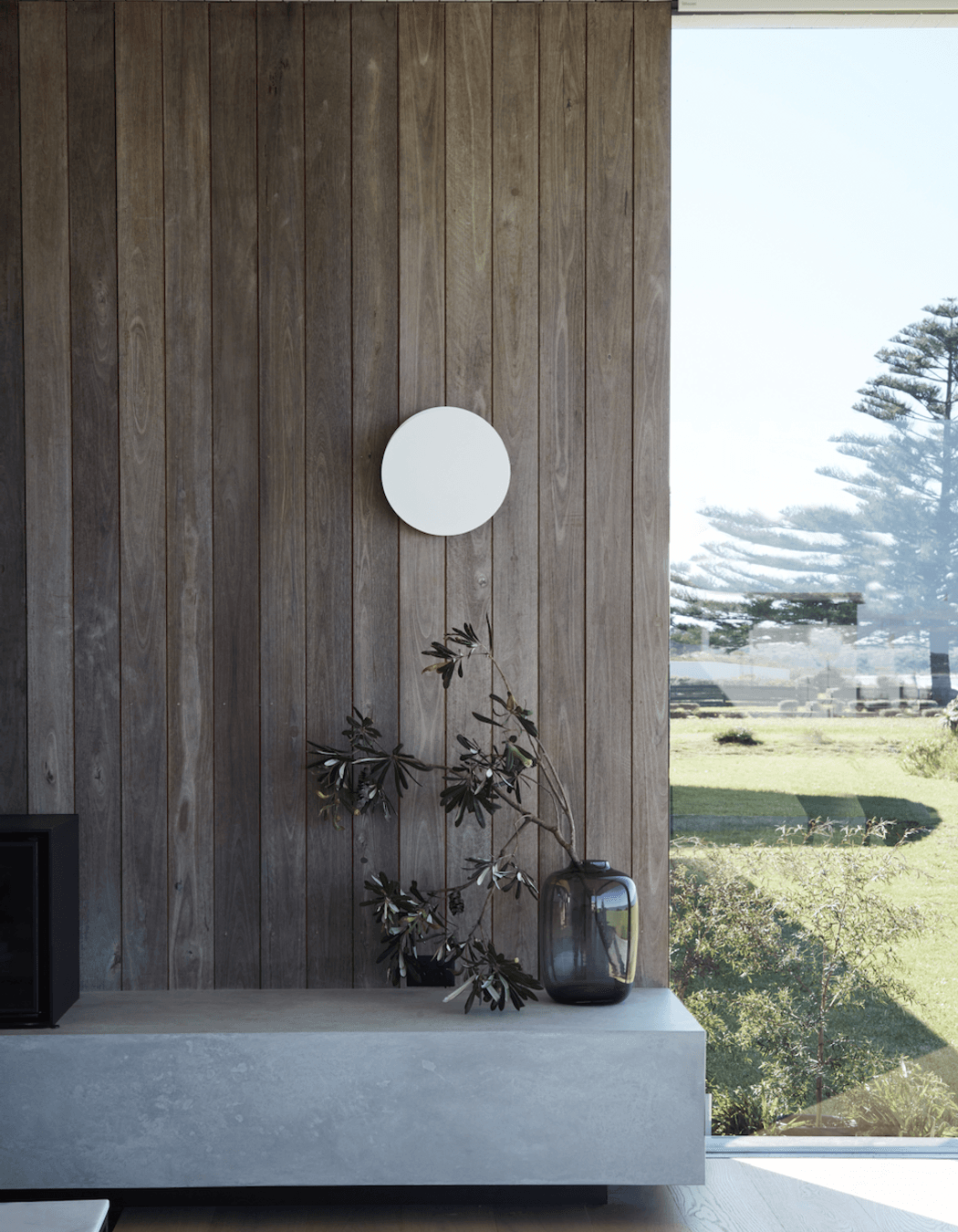 The home's weathered texture echoes the Australian landscape's inherent longevity and resilience.