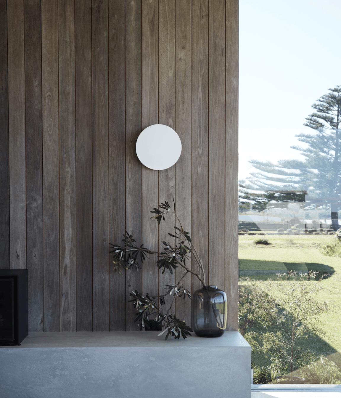 The home's weathered texture echoes the Australian landscape's inherent longevity and resilience.