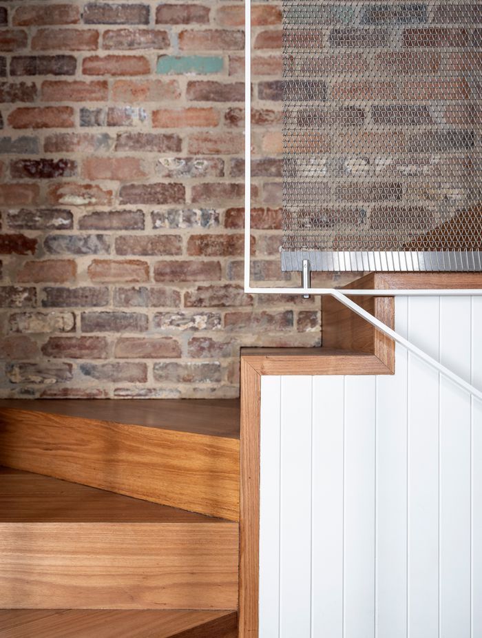 A unique metal curtain addressed both the handrail and lighting issues upstairs.