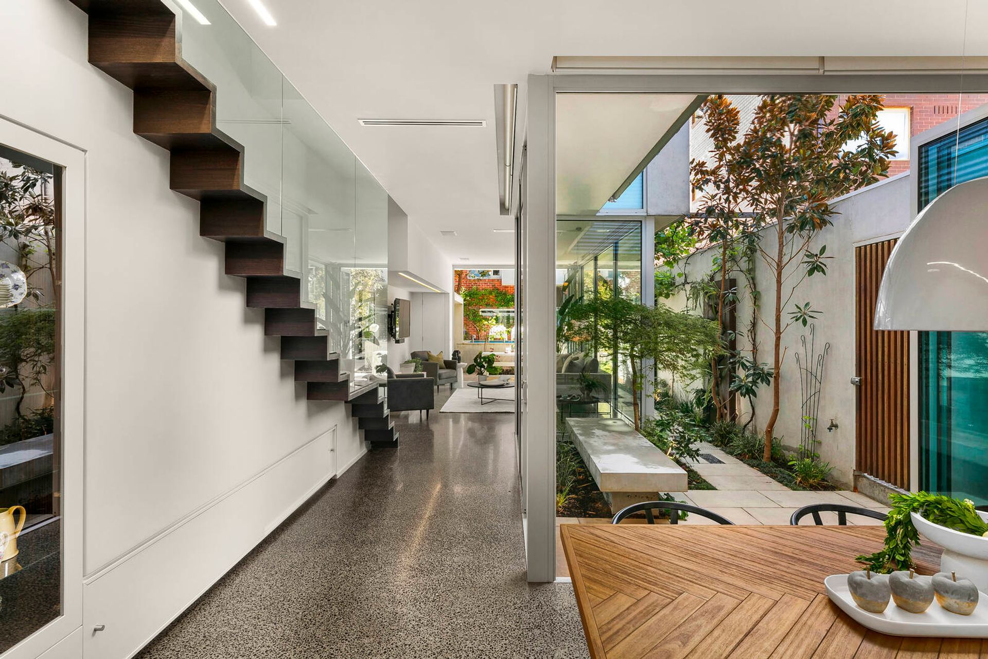 The dichotomy of the solid glassy street-level aesthetic with the more refined and sculpted upper level creates balance, privacy and seclusion without losing out on an inclusive living environment.