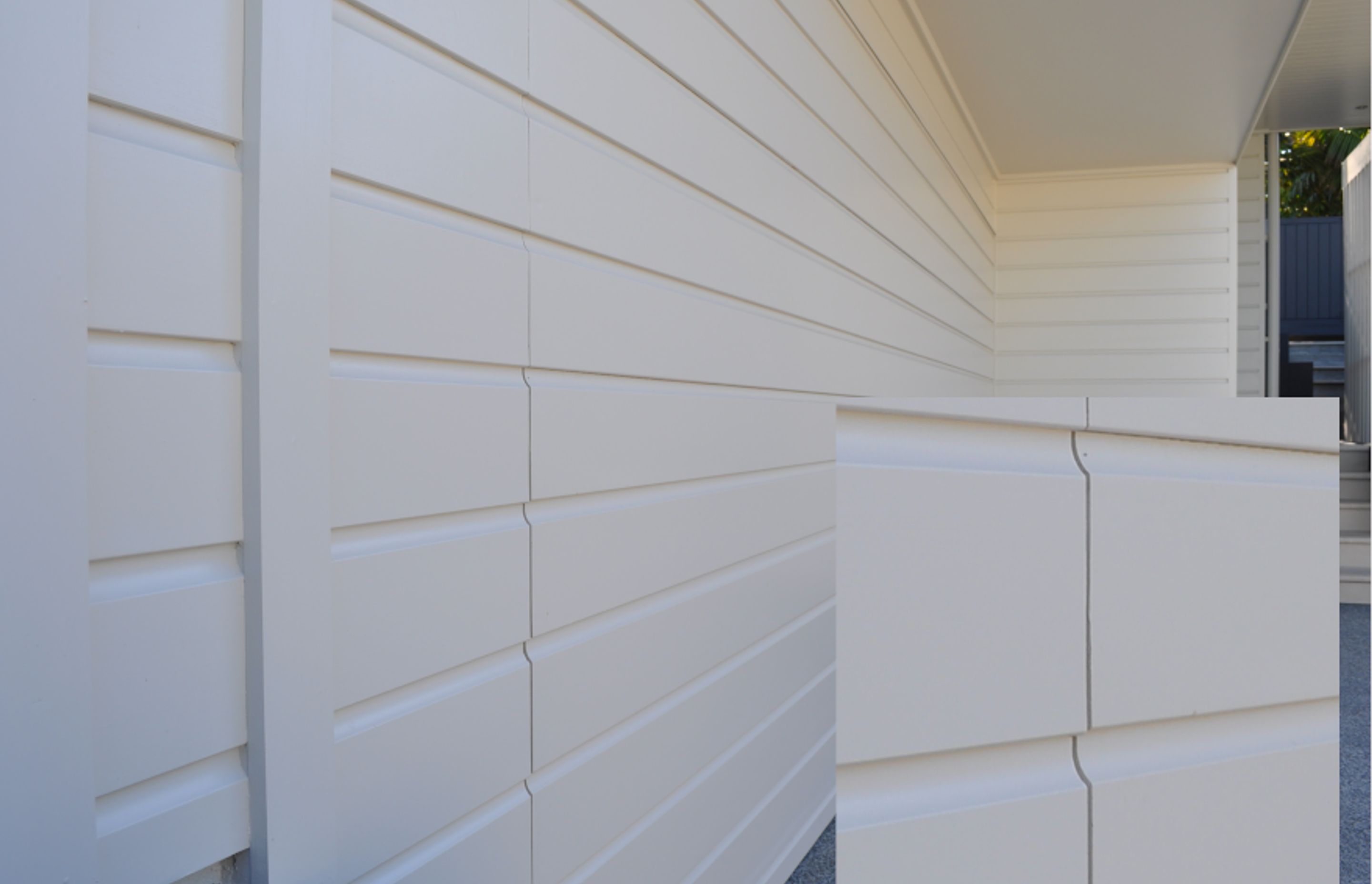 Seen here incorporating horizontal weatherboards, Flushmount garage doors can be custom made in a range of materials to suit any style of architecture from contemporary through to more traditional styles.
