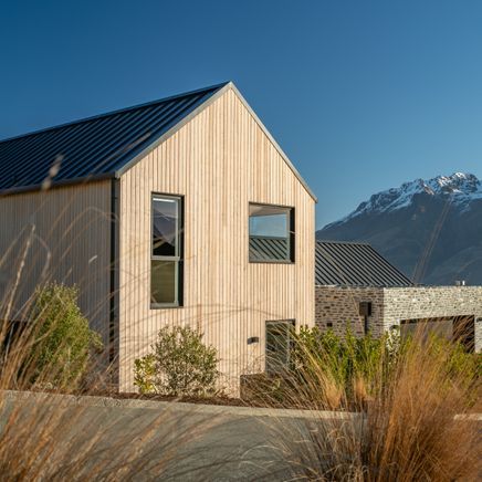 A gabled home framing mountain views in Queenstown