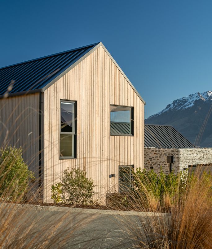 A gabled home framing mountain views in Queenstown