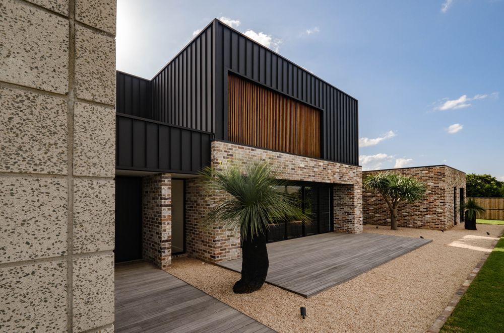 Metal cladding creates clean lines and a minimalist aesthetic on this facade