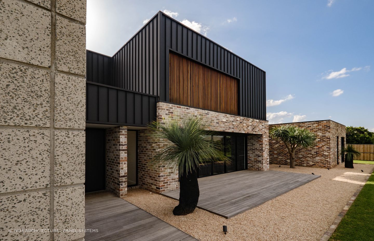 Metal cladding creates clean lines and a minimalist aesthetic on this facade