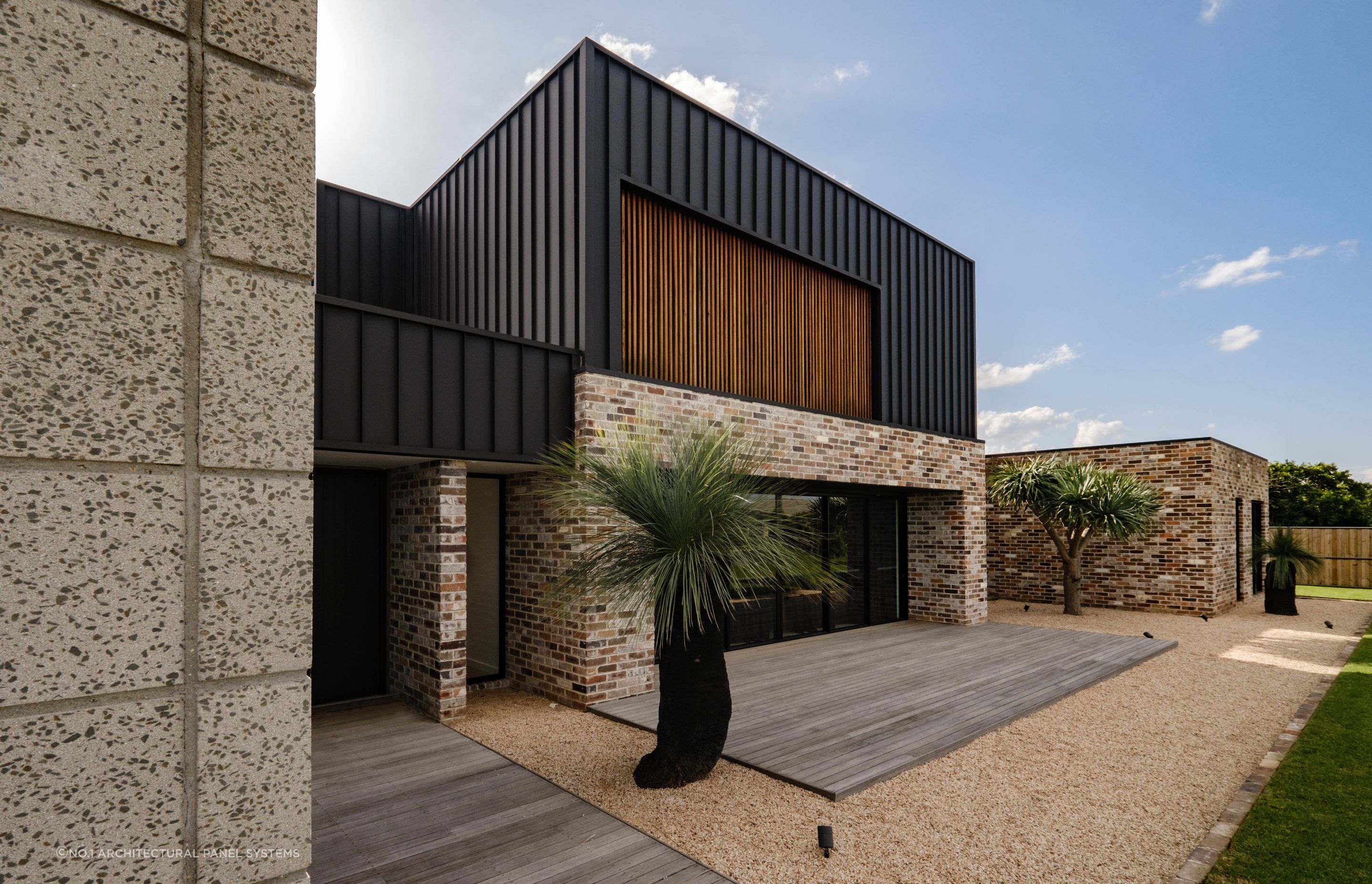 Metal cladding creates clean lines and a minimalist aesthetic on this facade
