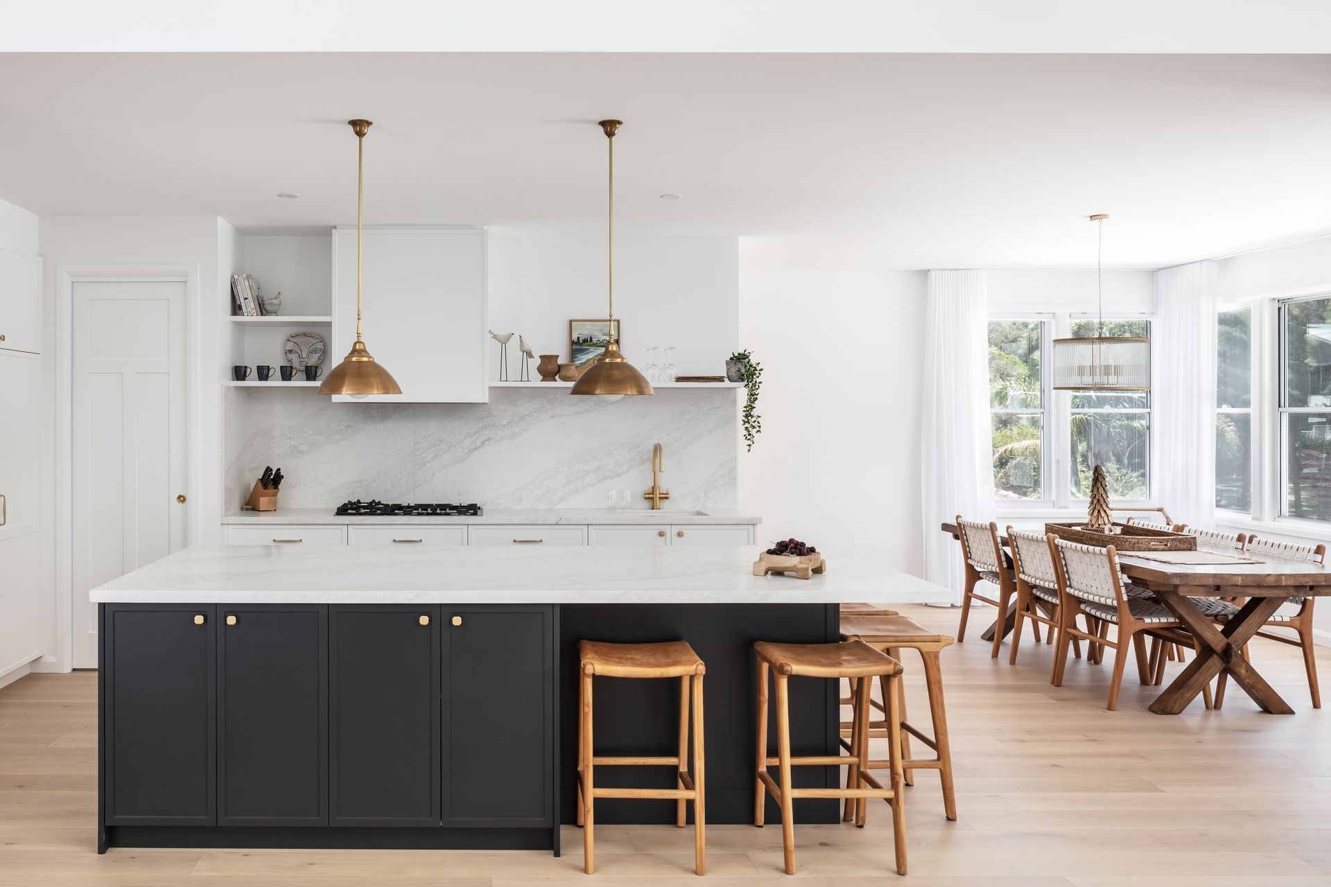Dark cabinetry adds depth to the light, muted tones.