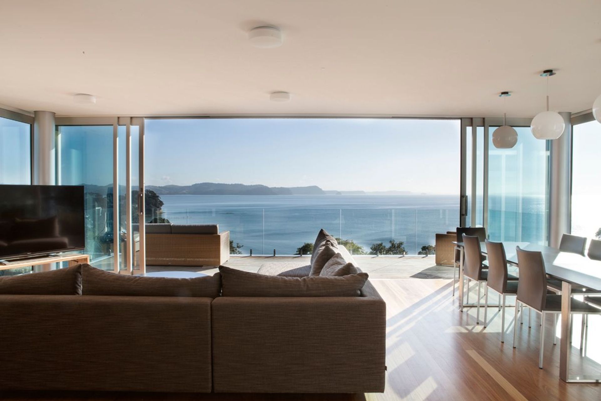Glass doors, such as these by Windowmakers, provide a lot of area for light to stream inside. 