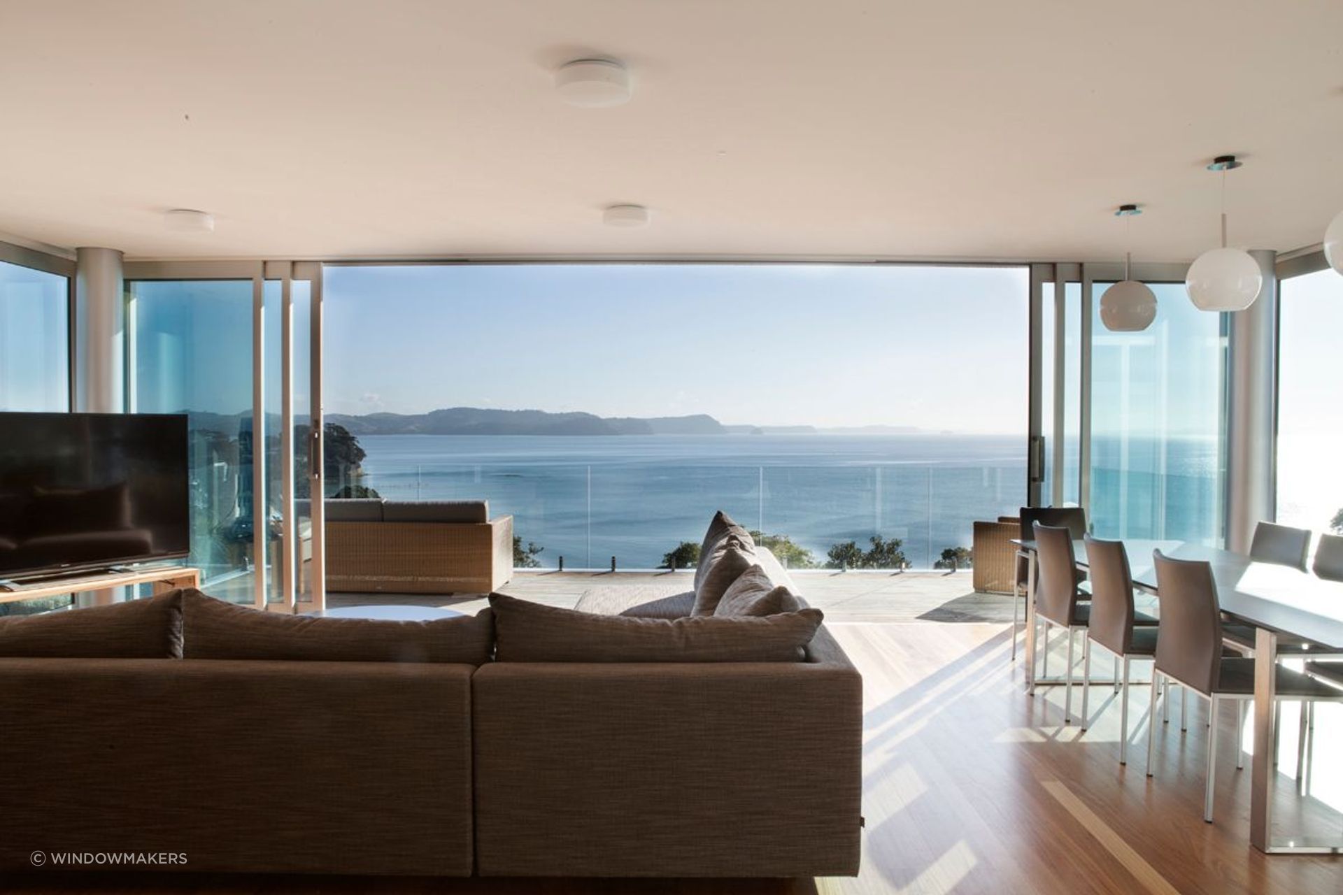 Glass doors, such as these by Windowmakers, provide a lot of area for light to stream inside.