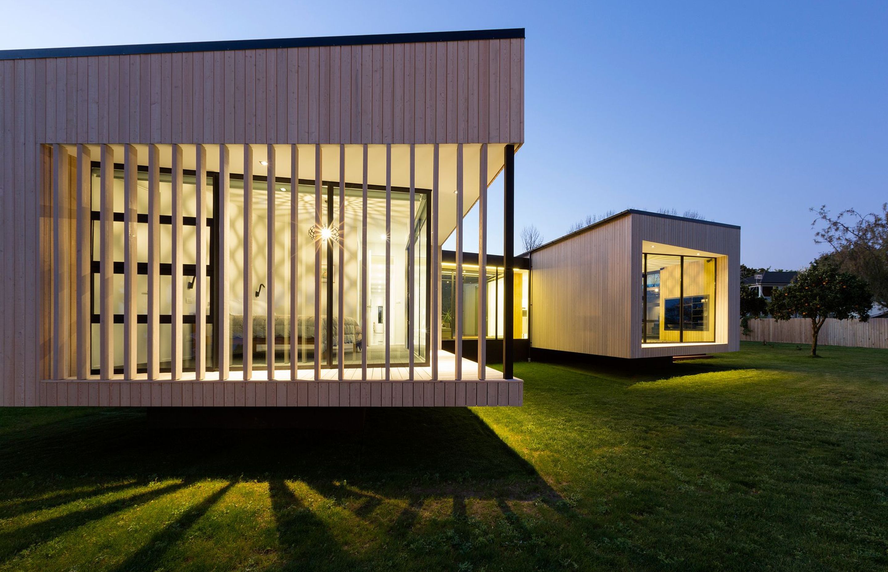 Noel Jessop Architects' Floating Boxes are two interconnected boxes that appear to hover off the ground, cleverly angled to take in the local mountain view. Photograph by Amanda Aitken Photography.