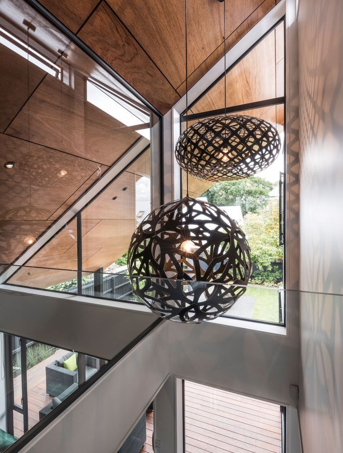 The artfully constructed ply lining on the ceiling extends right out into the eaves outside.