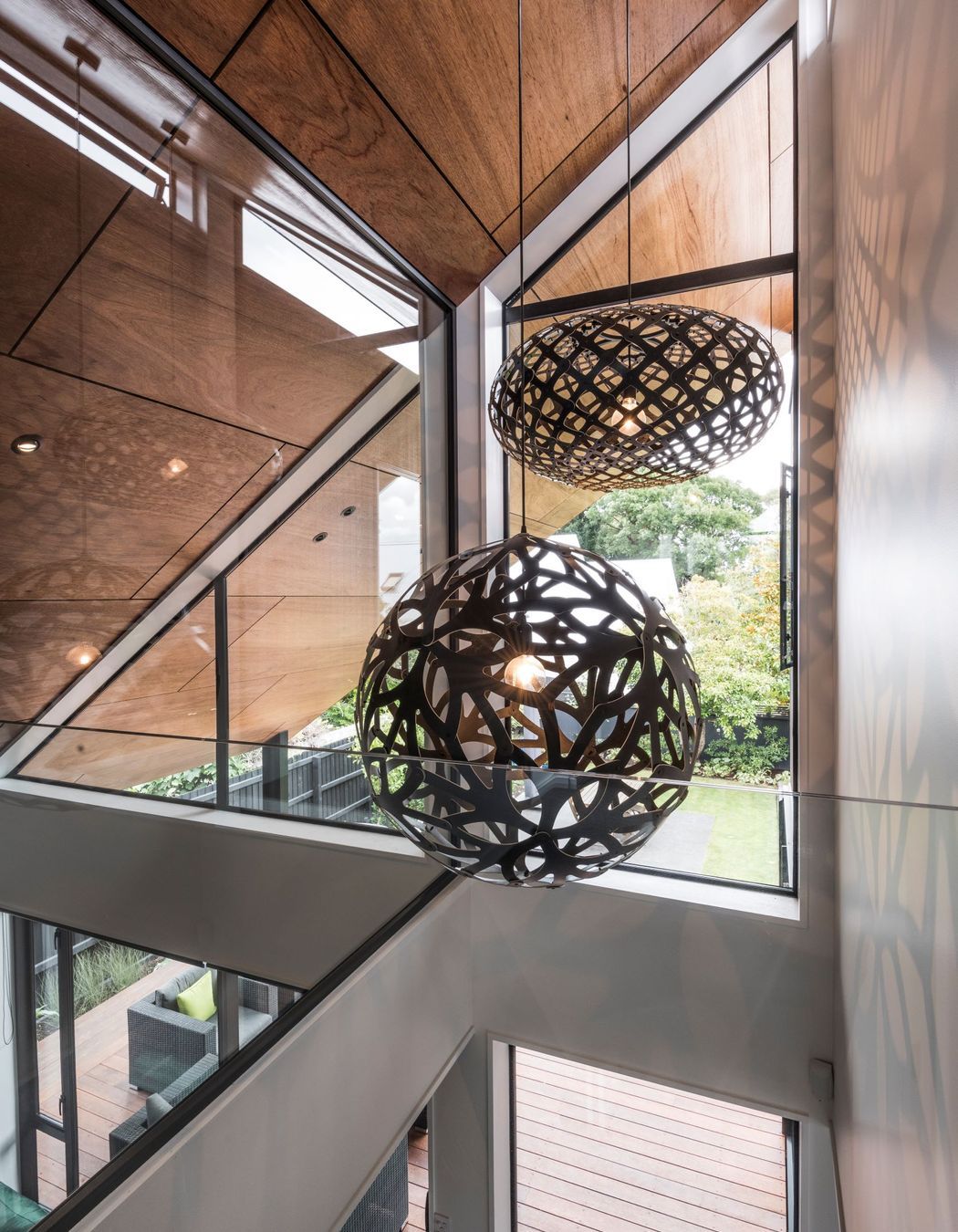 The artfully constructed ply lining on the ceiling extends right out into the eaves outside.