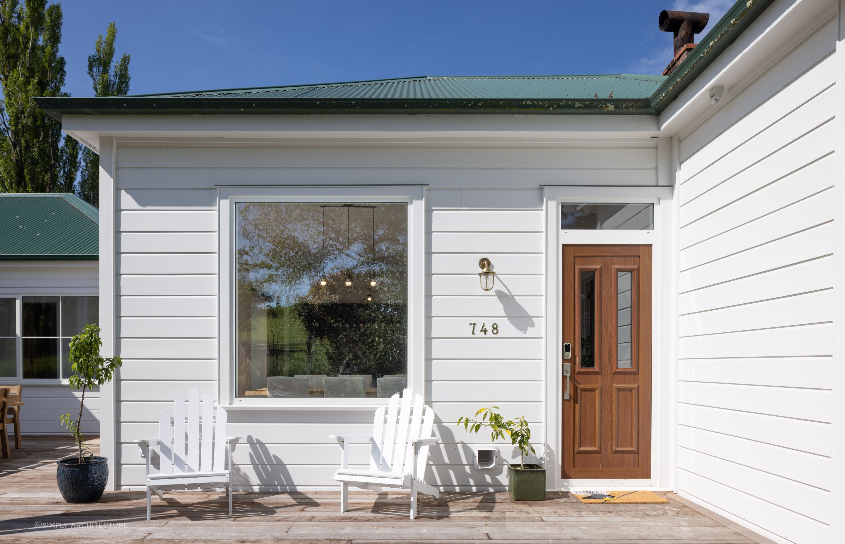 The 'Taihape Extension' by Simply Architecture saw a preservation of the home's farm-like aesthetic, whilst opening up the kitchen and living room, and adding a master suite and new bedroom.