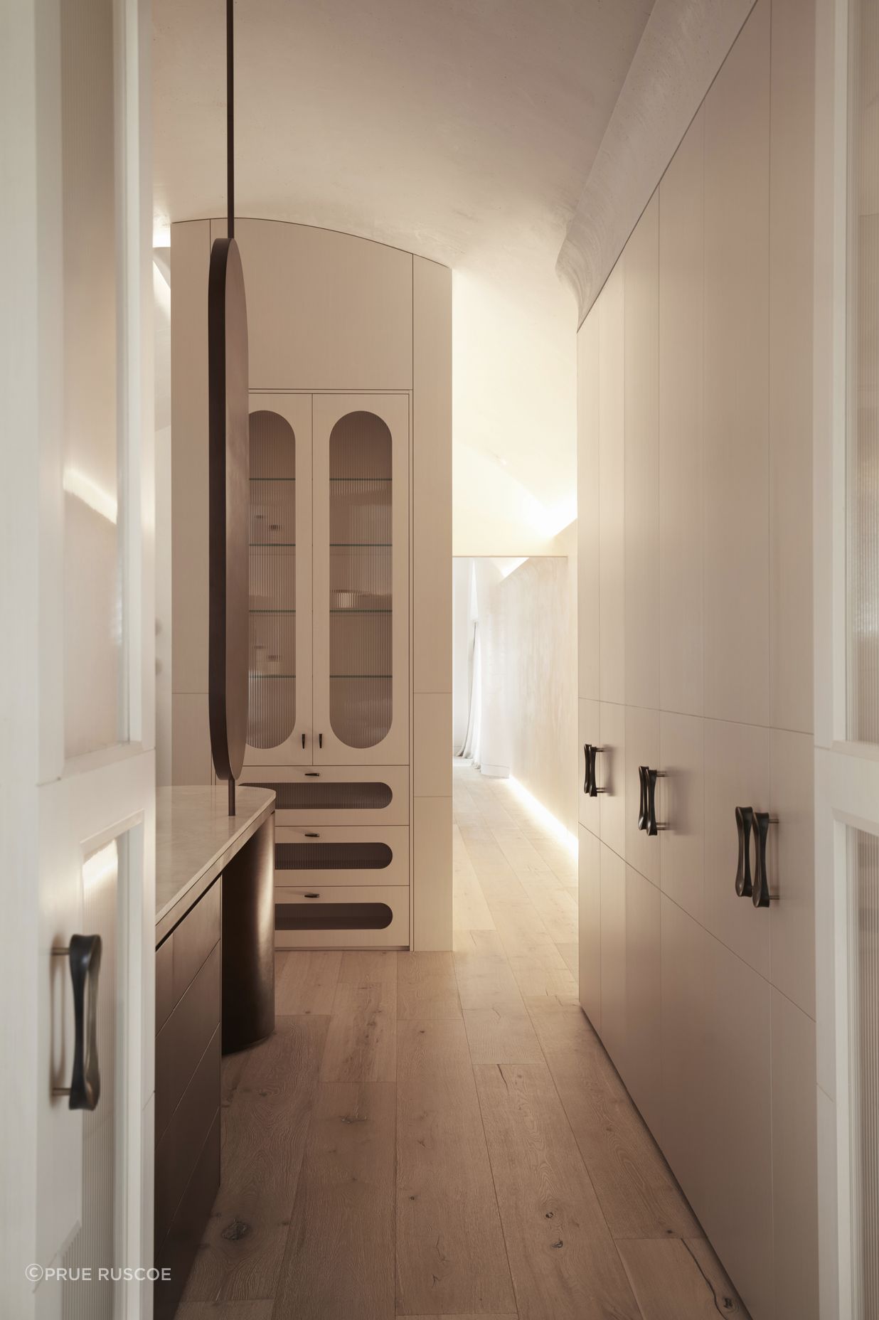 Accents of brass punctuate the cabinetry