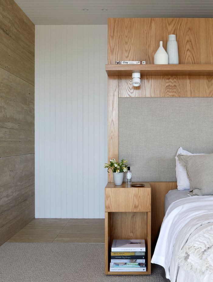 The main bedroom's built-in bedhead and side tables are a nod to mid-century design.