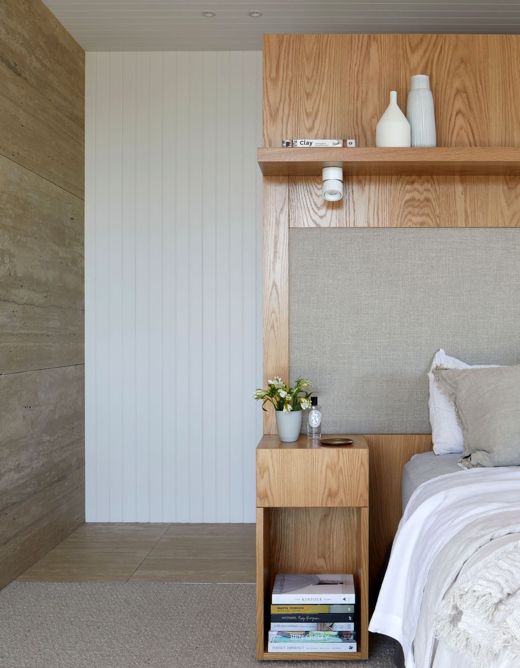 The main bedroom's built-in bedhead and side tables are a nod to mid-century design.