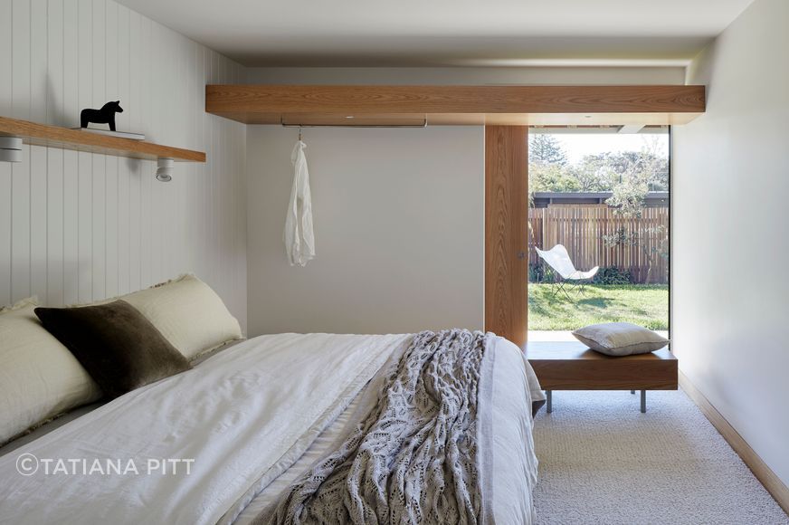 A downstairs guest bedroom with garden views.