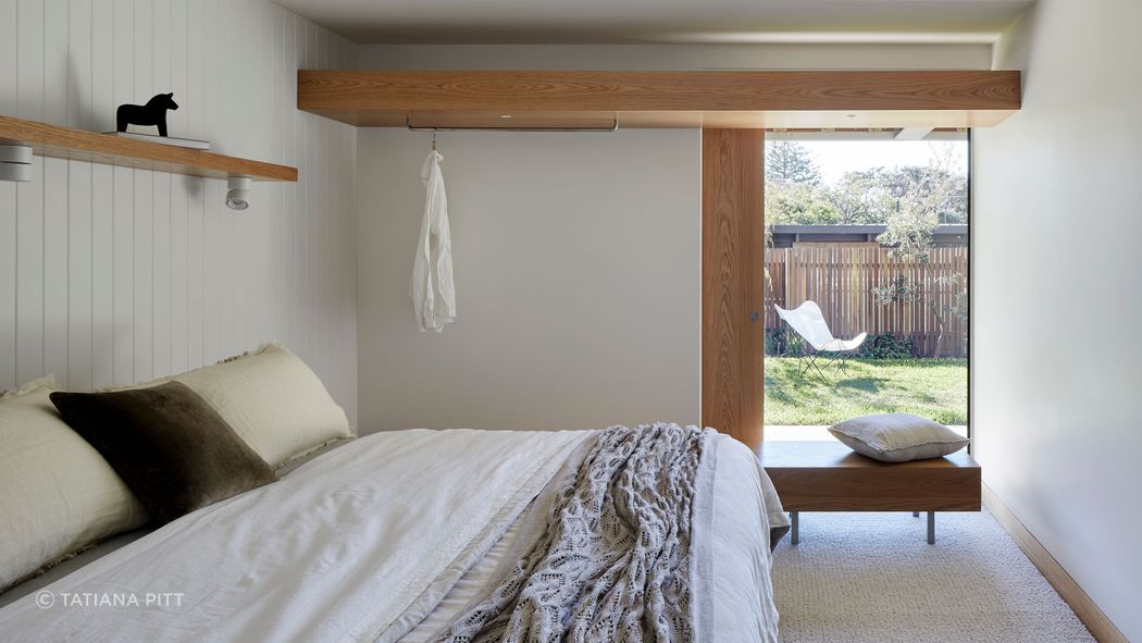 A downstairs guest bedroom with garden views.
