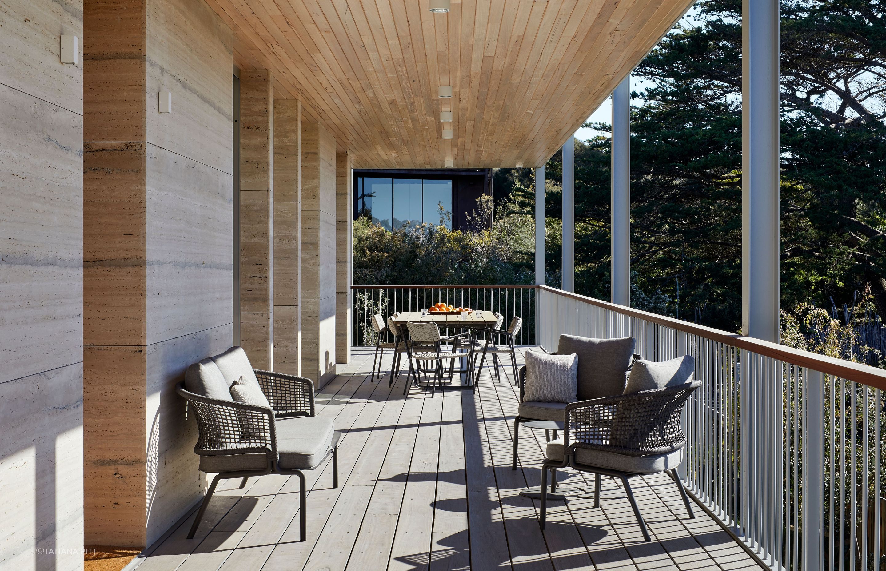 The large patio wraps the house, offering views of the dunes.