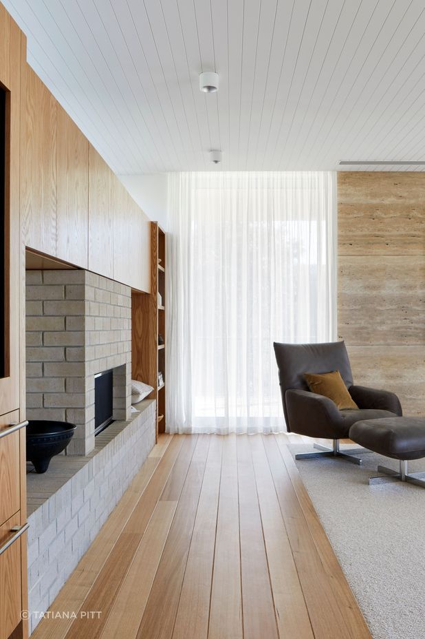 American oak flooring frames the inset wool carpets.