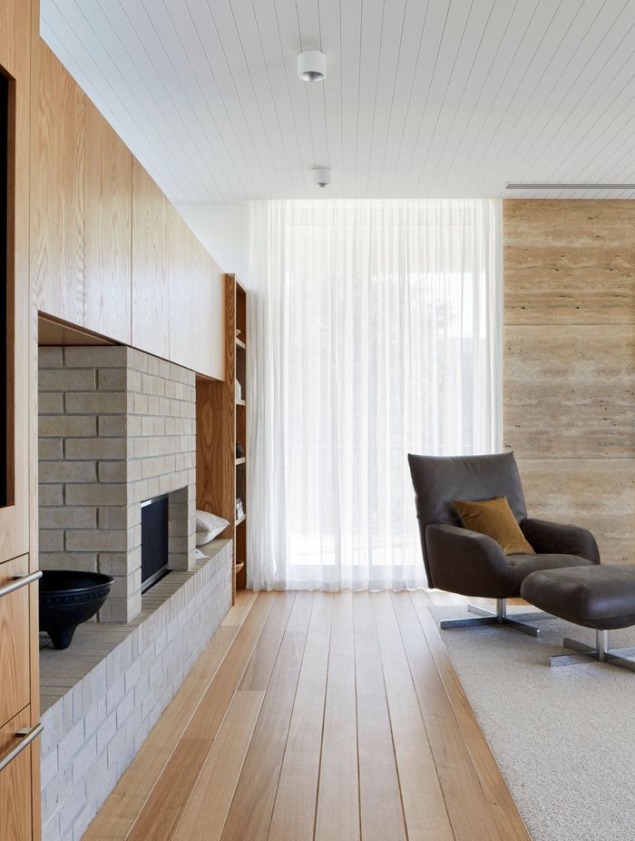 American oak flooring frames the inset wool carpets.