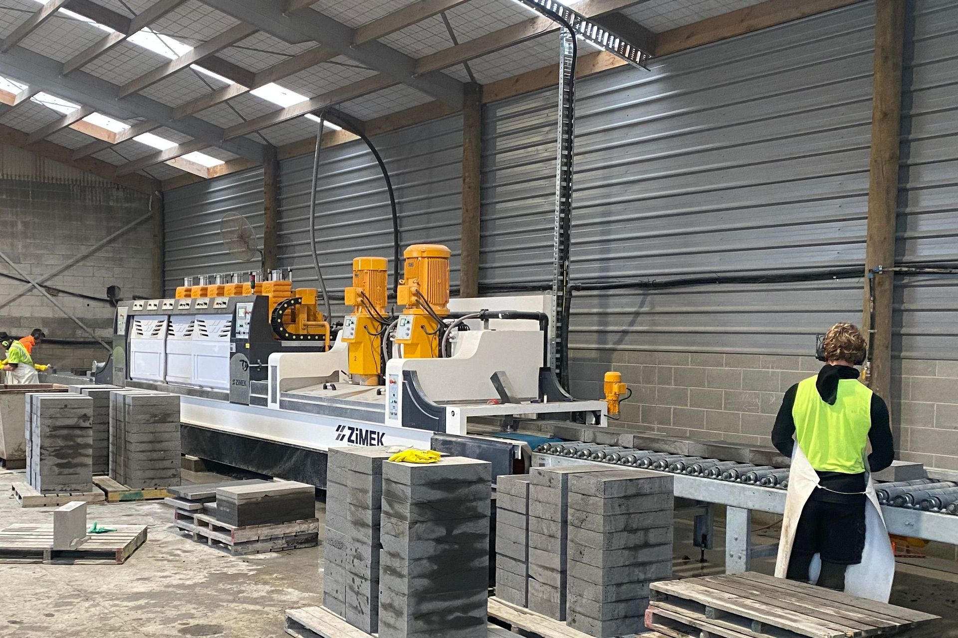 Timaru Bluestone's new polishing machine in action.