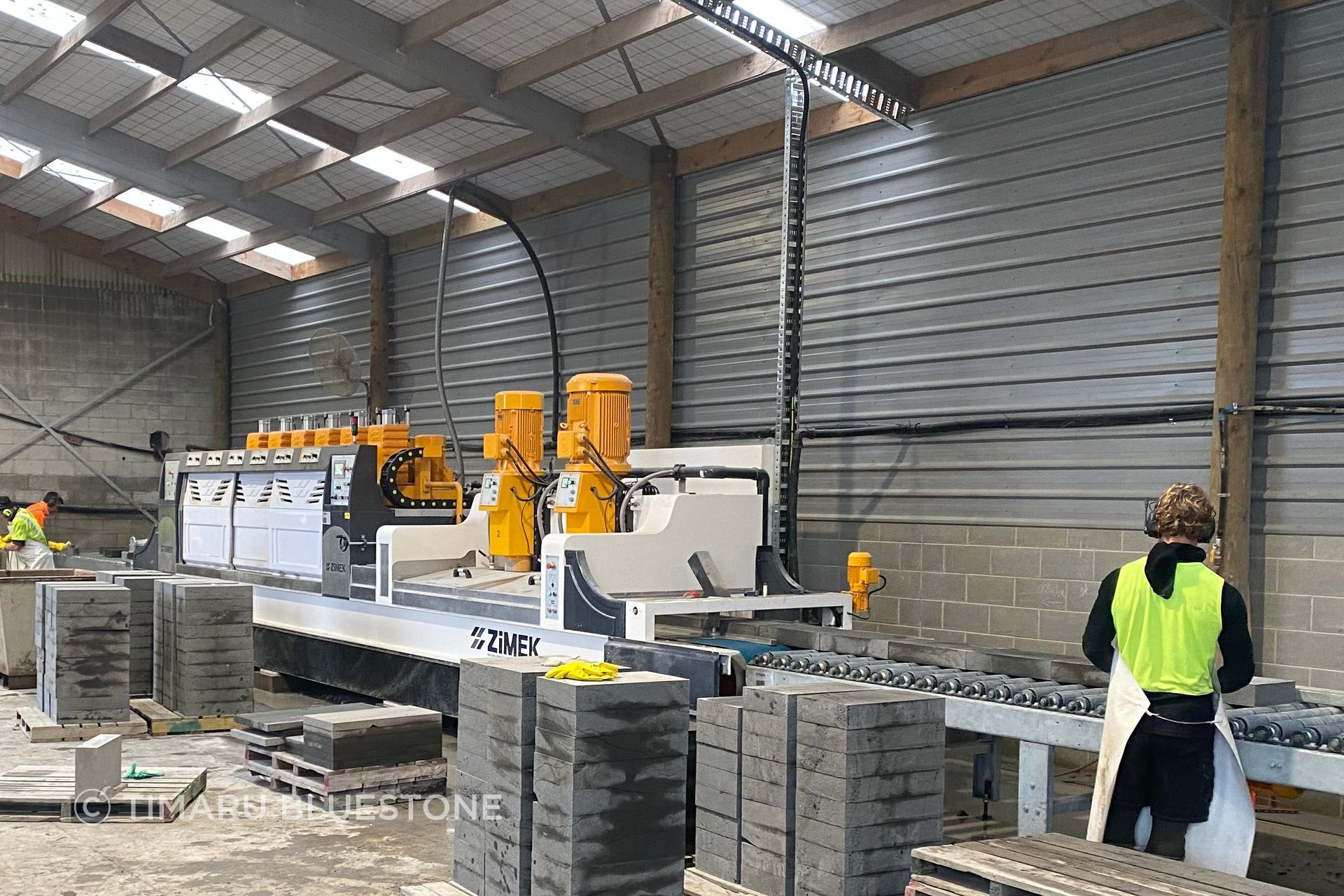 Timaru Bluestone's new polishing machine in action.