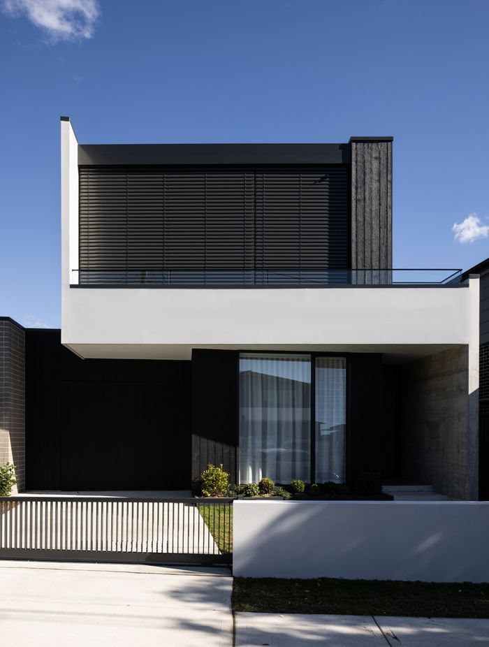 Motorised blinds provide privacy for the main bedroom.