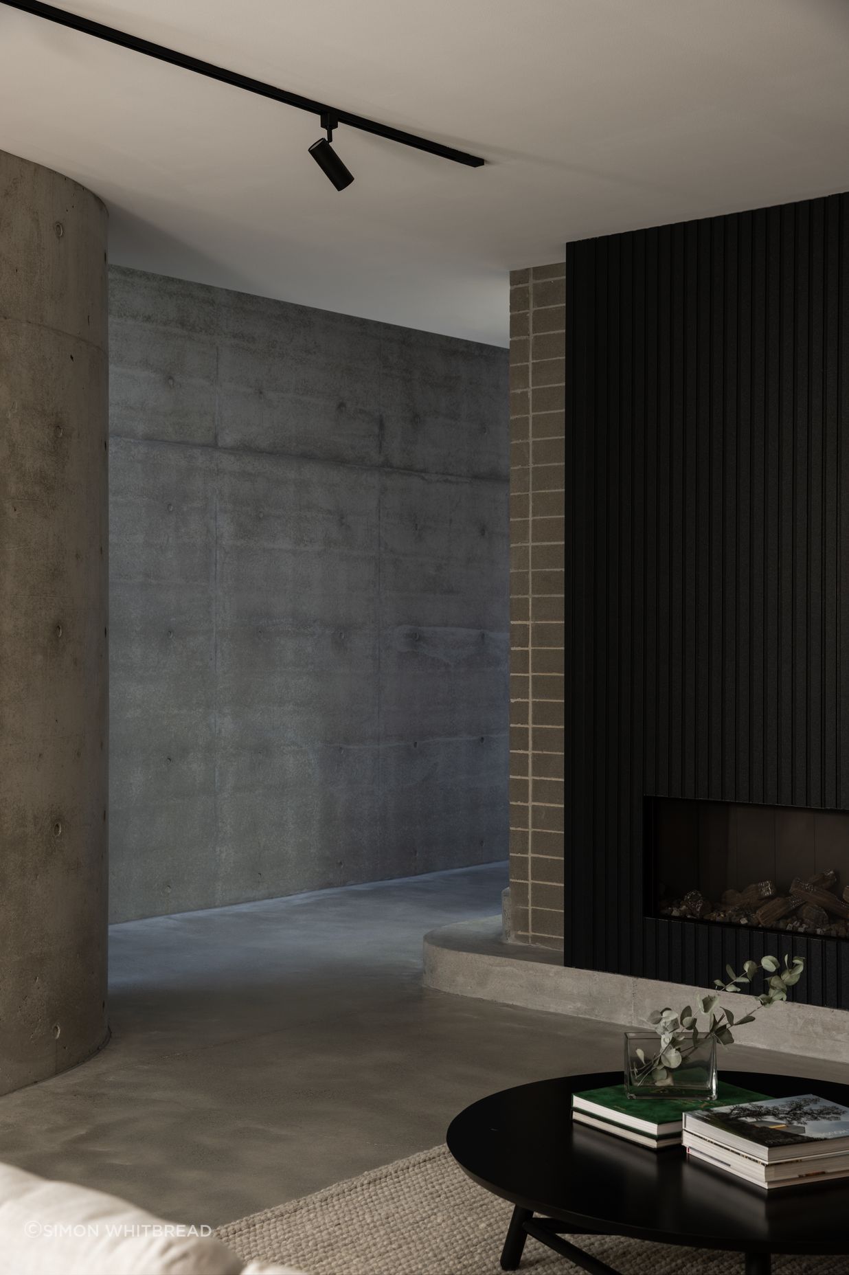 Monochromatic greys and robust materials line the downstairs.